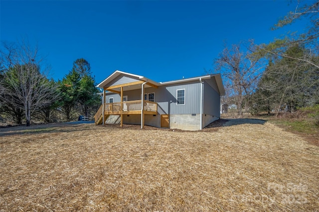 back of property with covered porch