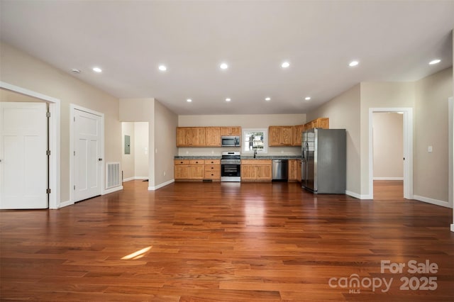 kitchen featuring electric panel, sink, dark wood-type flooring, and appliances with stainless steel finishes