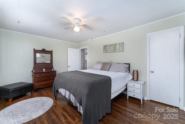 bedroom featuring ceiling fan, dark hardwood / wood-style flooring, and crown molding