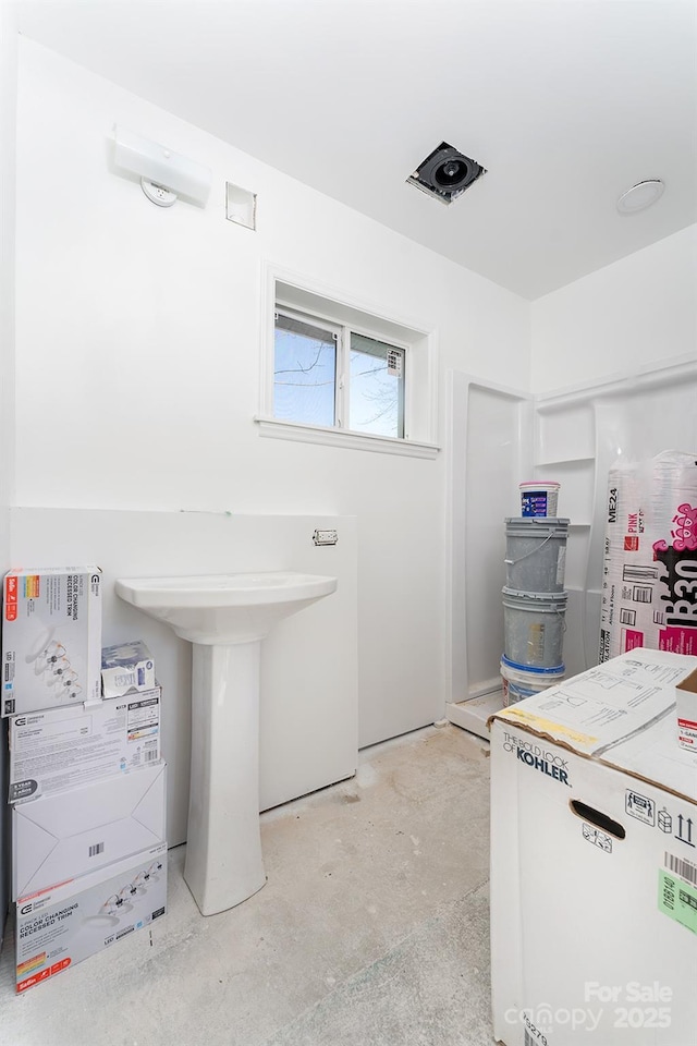 bathroom with concrete floors