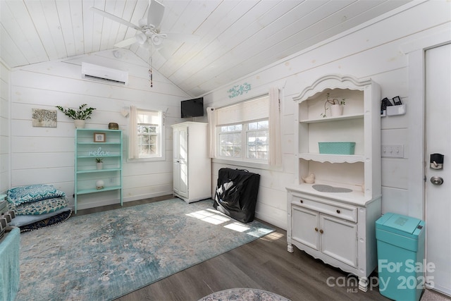 interior space with dark hardwood / wood-style flooring, an AC wall unit, wooden walls, and wood ceiling