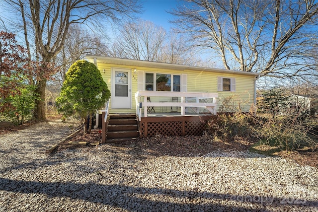 view of front of home featuring a wooden deck