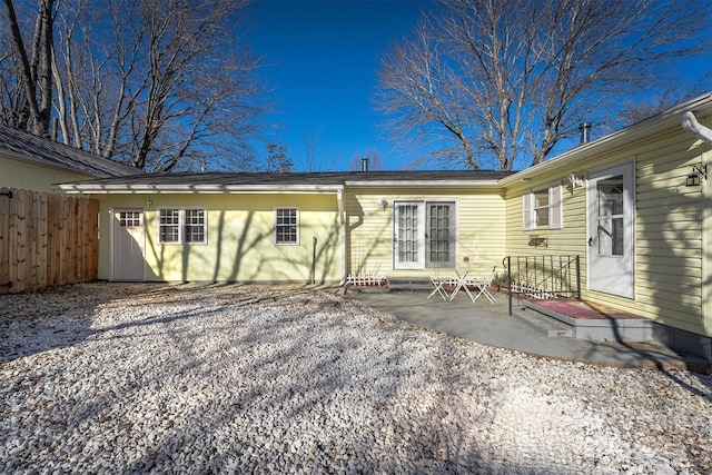 back of house with a patio