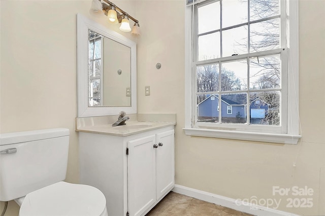 bathroom with vanity, toilet, and tile patterned flooring