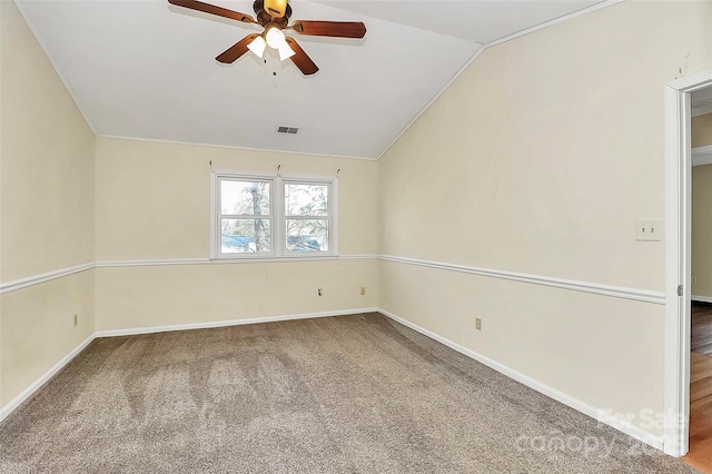 spare room with ceiling fan, carpet flooring, and lofted ceiling