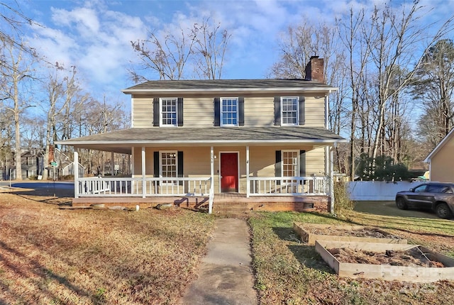 farmhouse inspired home featuring covered porch