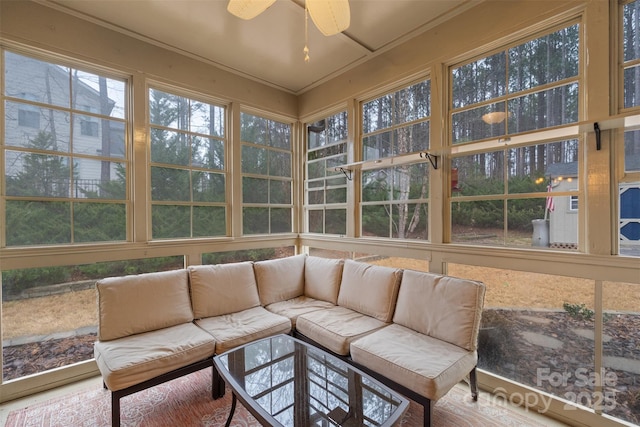 sunroom with ceiling fan and plenty of natural light