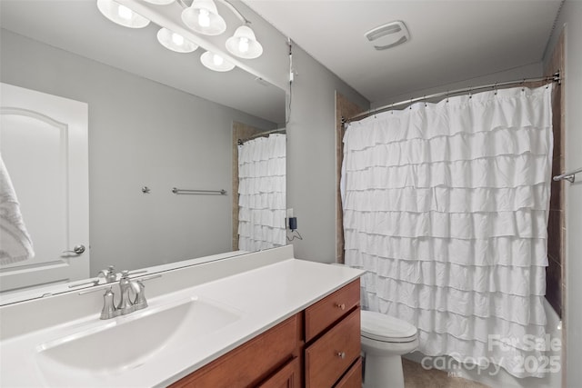 bathroom featuring vanity, toilet, and a shower with curtain