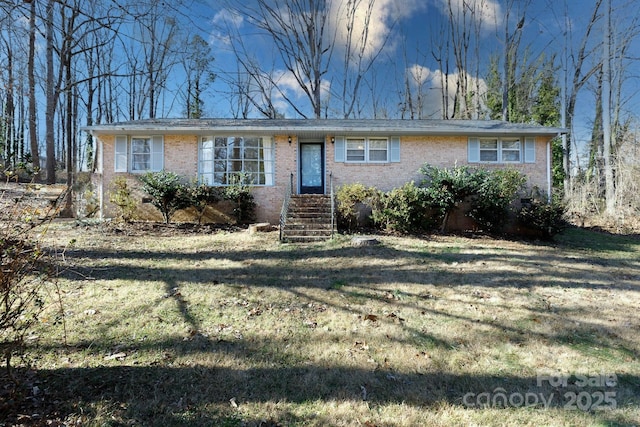 ranch-style house with a front yard