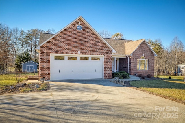 view of front of house with a garage and a front lawn