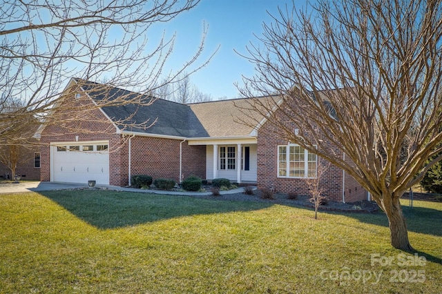 view of front of property featuring a garage and a front yard