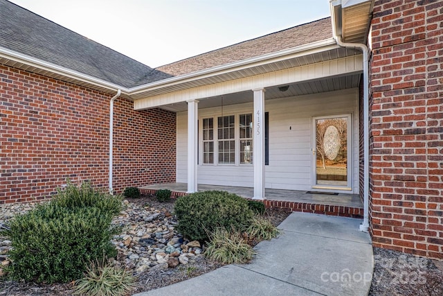 doorway to property with covered porch