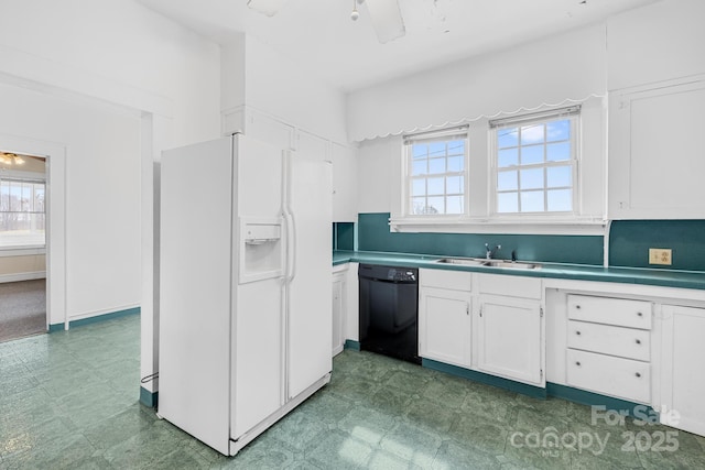 kitchen featuring white cabinetry, a sink, white refrigerator with ice dispenser, dishwasher, and tile patterned floors