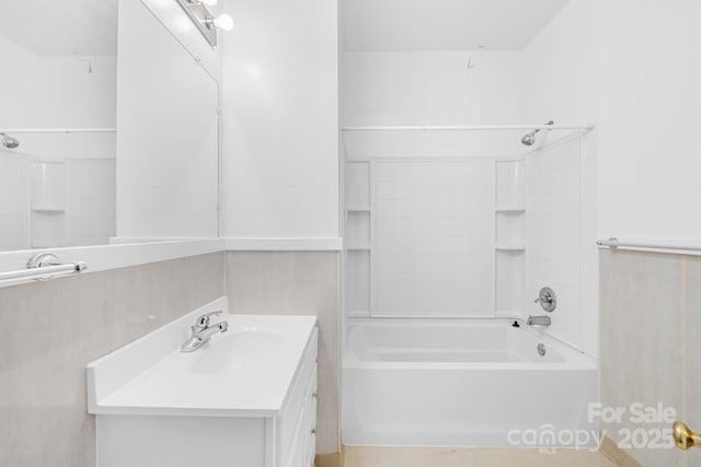 bathroom featuring vanity and washtub / shower combination