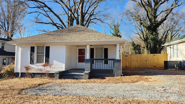 bungalow-style home with covered porch and central AC unit