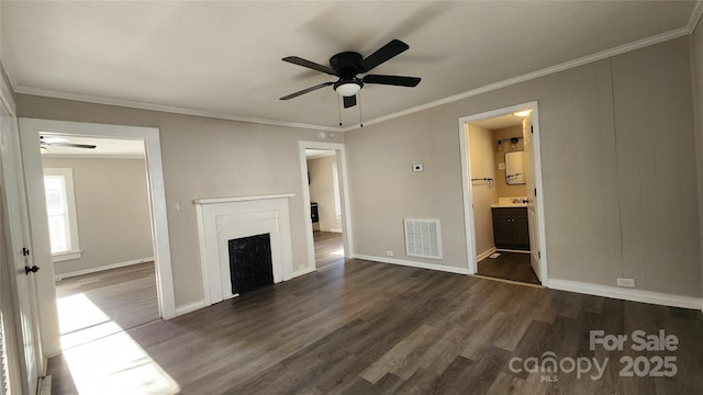 unfurnished living room featuring ceiling fan, dark hardwood / wood-style flooring, sink, and ornamental molding