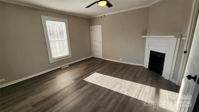 unfurnished living room featuring crown molding, ceiling fan, and dark wood-type flooring