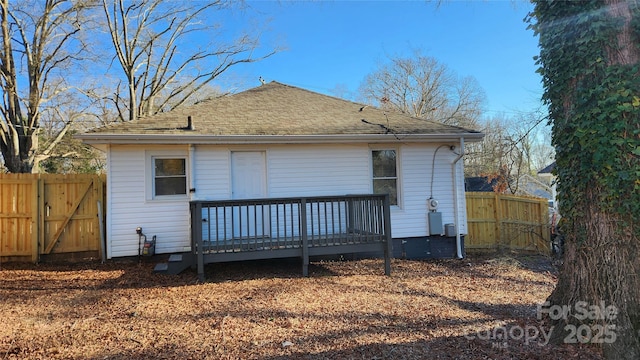 back of property with a wooden deck