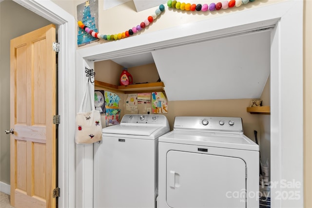 clothes washing area featuring separate washer and dryer