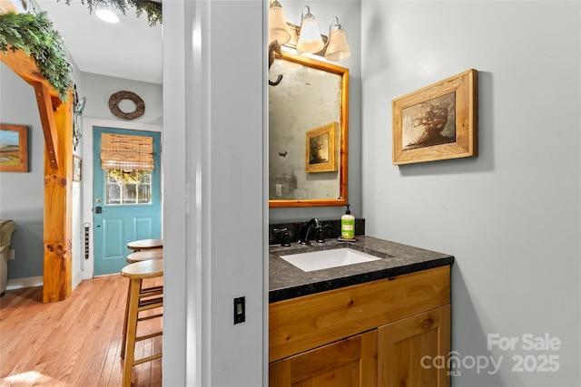 bathroom featuring vanity and hardwood / wood-style floors