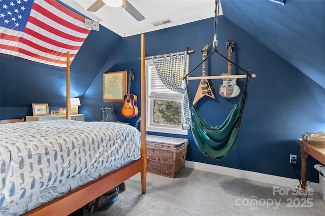 carpeted bedroom with ceiling fan and vaulted ceiling