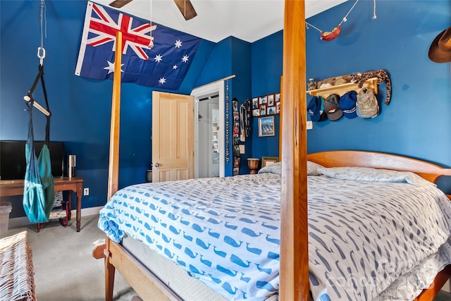 bedroom featuring ceiling fan, lofted ceiling, and carpet flooring