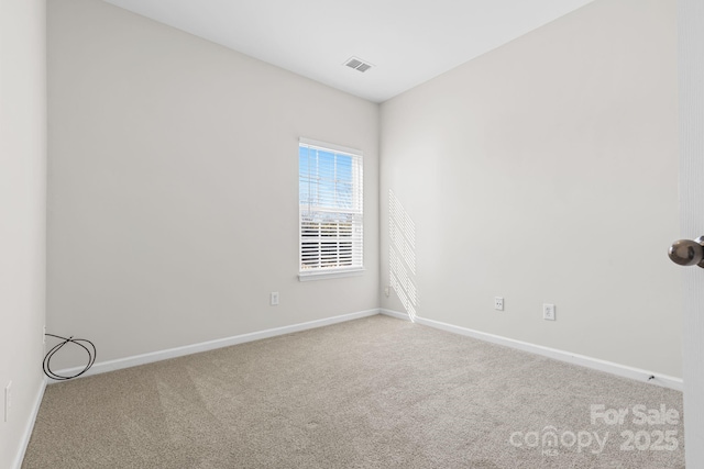 unfurnished room featuring carpet