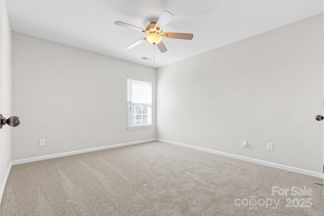 carpeted empty room with ceiling fan