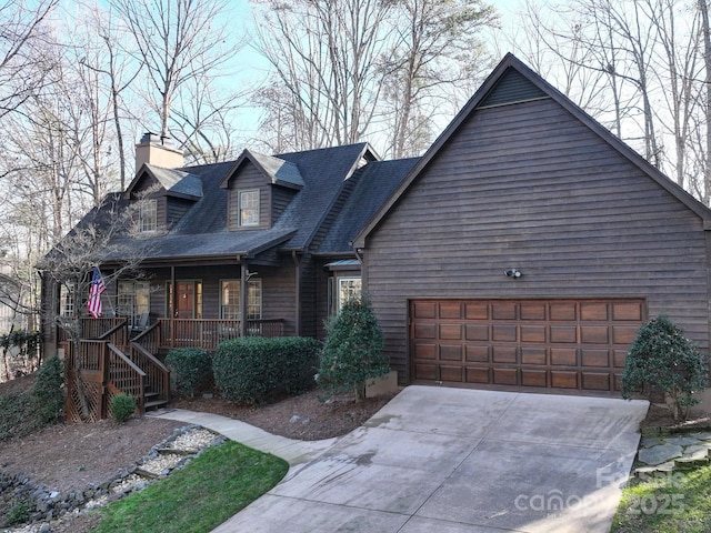 view of front of property with covered porch and a garage