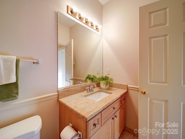 bathroom with vanity and toilet