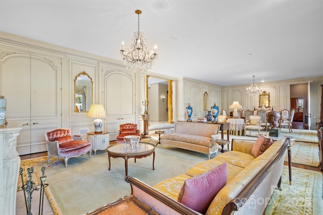 carpeted living room featuring an inviting chandelier