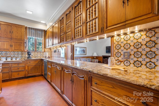 kitchen with light stone counters, crown molding, dishwasher, kitchen peninsula, and backsplash