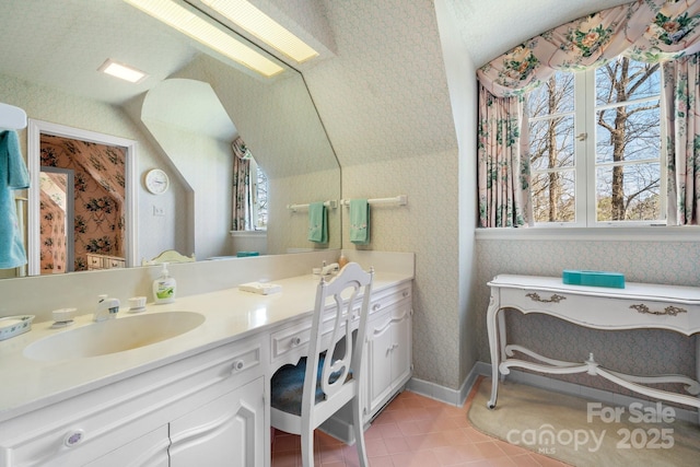 bathroom with tile patterned floors and vanity