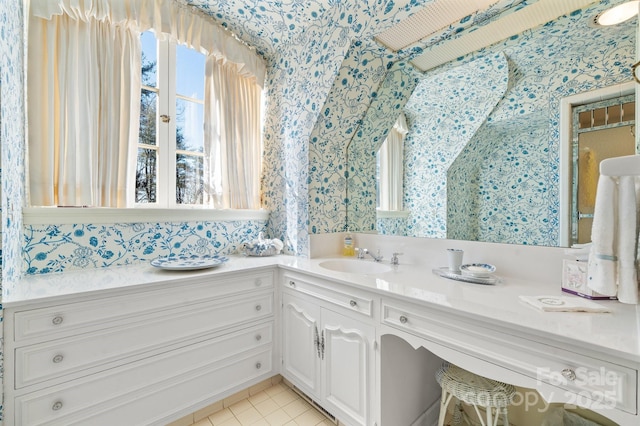 bathroom with plenty of natural light, tile patterned flooring, and vanity