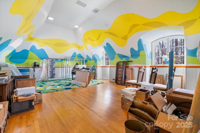 recreation room with vaulted ceiling and light wood-type flooring