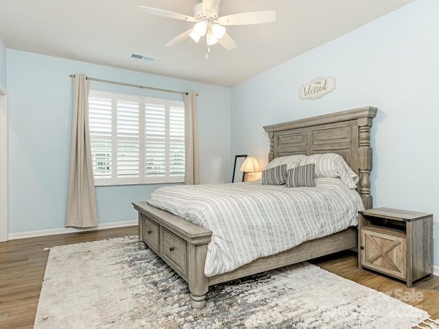 bedroom featuring ceiling fan and hardwood / wood-style flooring