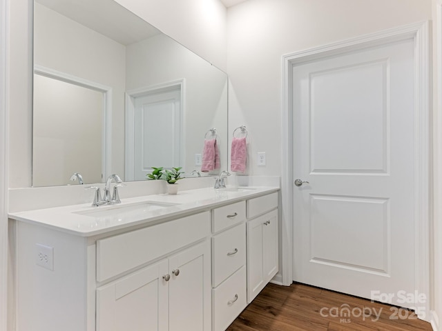 bathroom featuring vanity and hardwood / wood-style floors