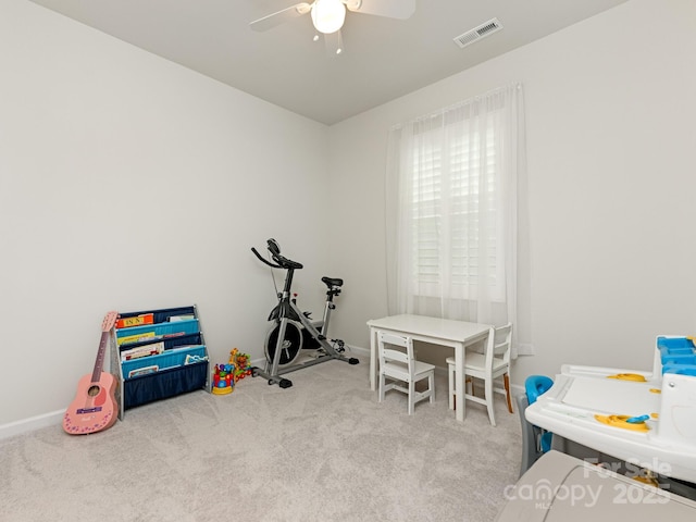 rec room featuring ceiling fan and light colored carpet