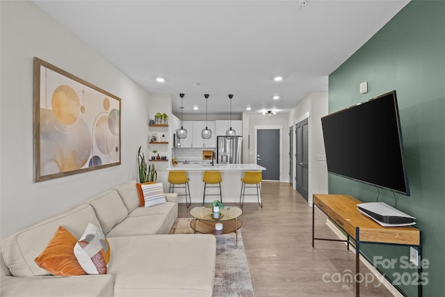 living room with light hardwood / wood-style flooring