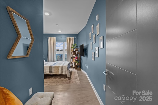 bedroom with wood-type flooring