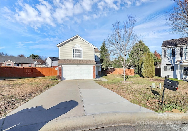 view of property with a garage and a front lawn