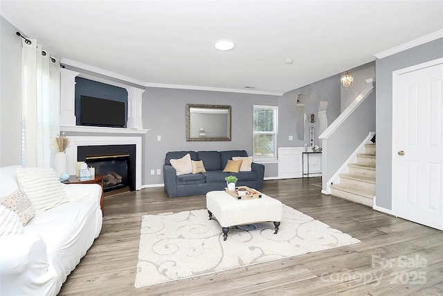 living room featuring crown molding and wood-type flooring