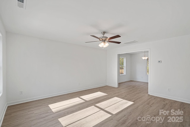 spare room featuring ceiling fan and light hardwood / wood-style floors