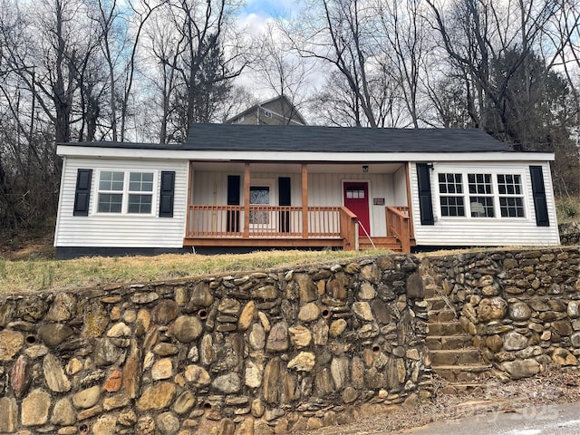 ranch-style home featuring covered porch