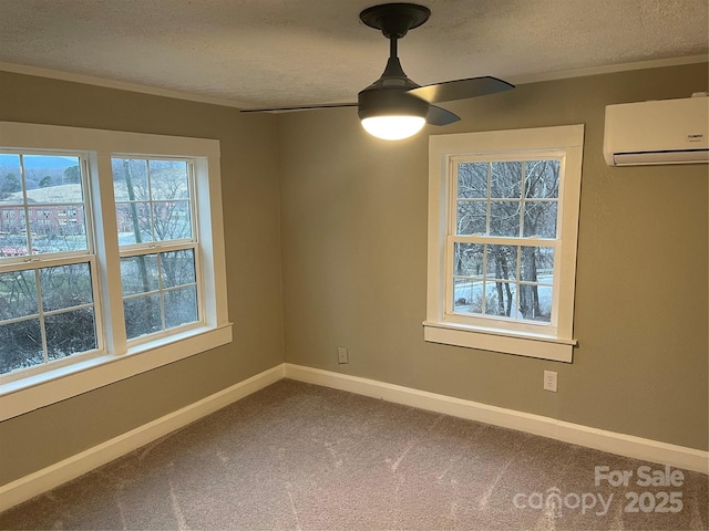 empty room with an AC wall unit, carpet floors, ceiling fan, crown molding, and a textured ceiling