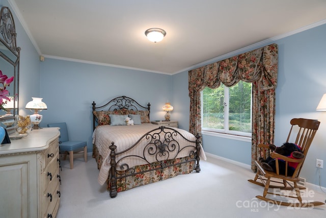 carpeted bedroom with ornamental molding