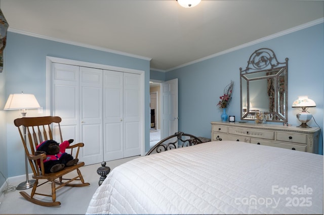 carpeted bedroom with a closet and ornamental molding