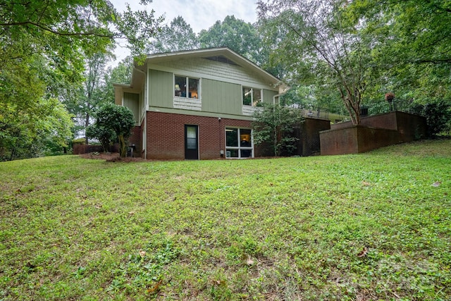 rear view of house with a lawn