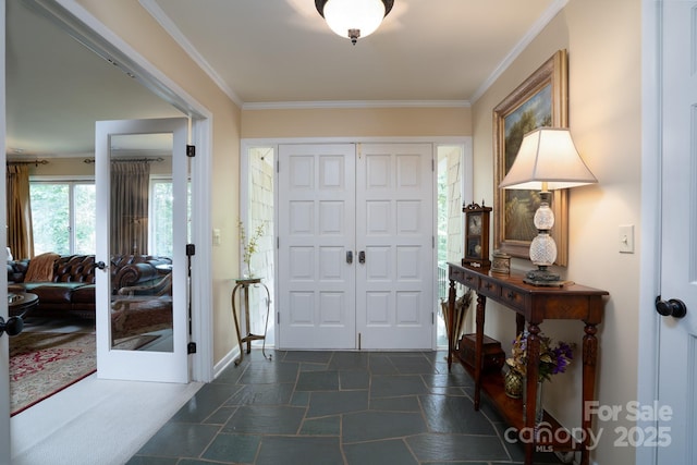 foyer featuring crown molding