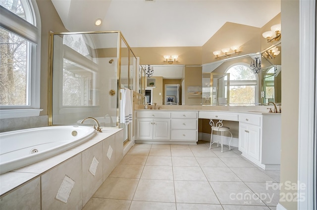 bathroom with vanity, lofted ceiling, plenty of natural light, and tile patterned floors